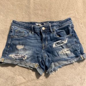Distressed mid rise jean shorts. Soft and stretchy.